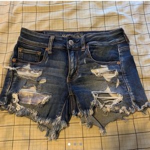AEO Mid Rise Ripped Denim Shorts